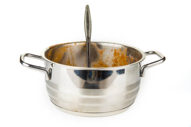 istock Dirty kitchen pot with ladle from a tomato soup 1138469744