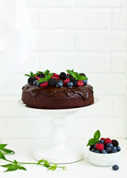 istock Chocolate cake with glaze and fresh berries 1138469746
