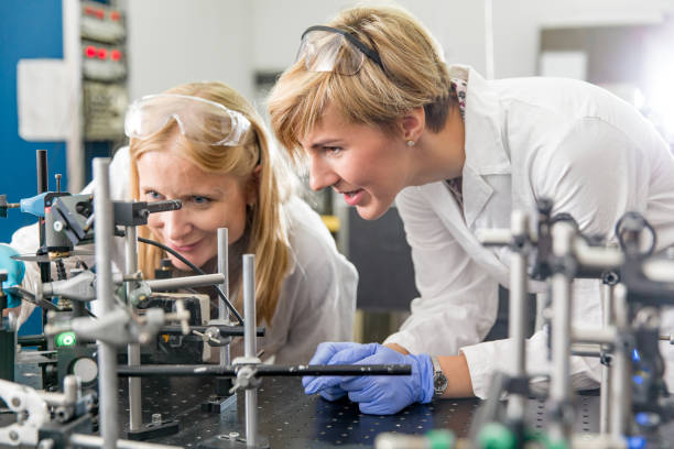 istock Female Researchers Assembling Laser Experimentation Platform Parts 1138469771