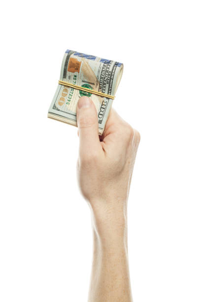 istock Finance concept with human hand holding dollar currency. US Dollars 100 bill 1138471539