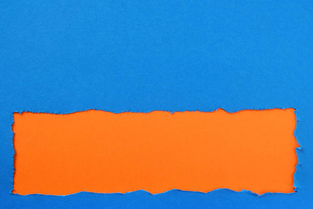 istock Torn blue paper strip orange background border frame 1138472252