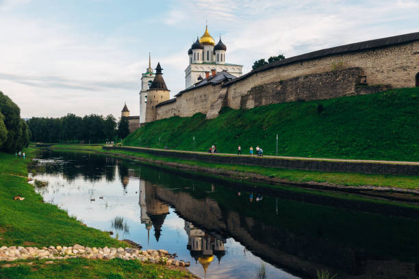istock Ancient Pskov Kremlin on river bank, Trinity church, day time 1138475660