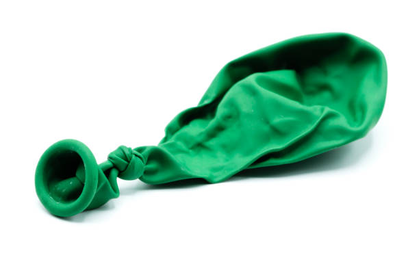 green balloon vacuum isolated on white background - deflated imagens e fotografias de stock