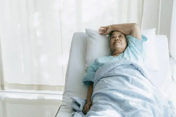 Lonely Elderly patients in hospital bed patients want to go home - medical and healthcare concept