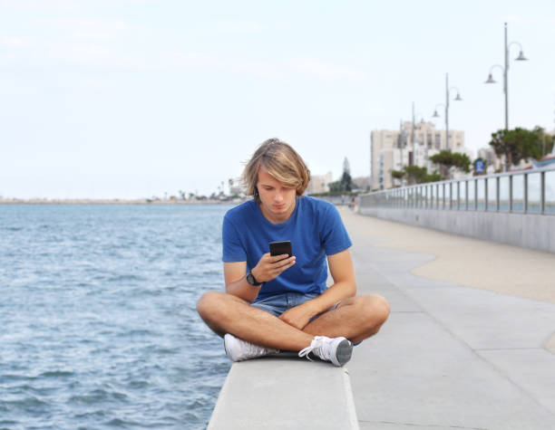 istock Teenage boy typing text message.Using smart phone. 1138478492