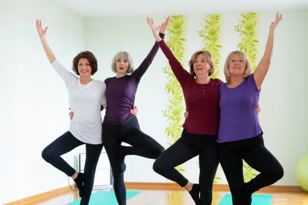 istock Senior women practicing  yoga in yoga studio 1138479674