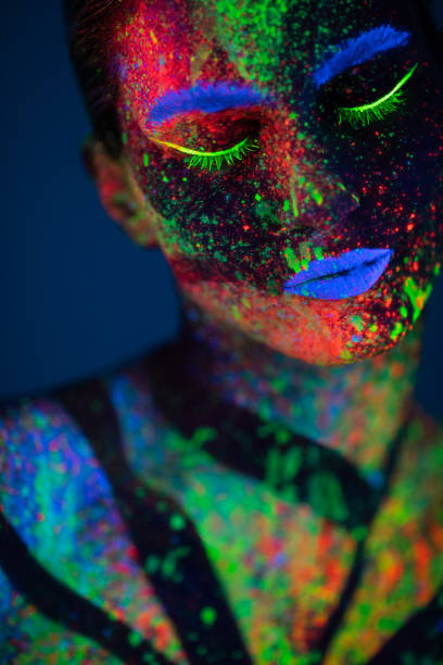 istock One woman painted with fluorescent make up 1138480158