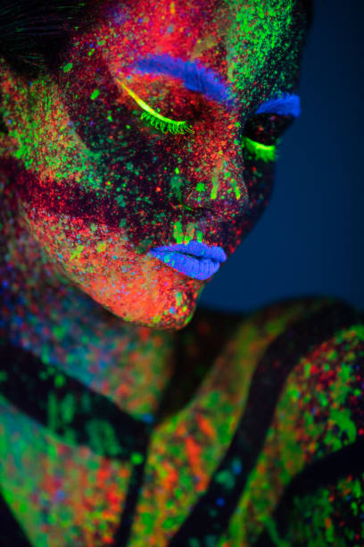 istock One woman painted with fluorescent make up 1138480159