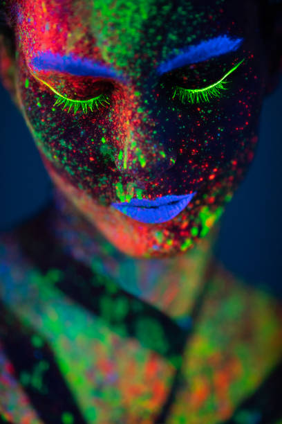 istock One woman painted with fluorescent make up 1138480163