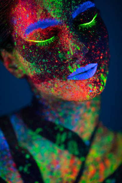istock One woman painted with fluorescent make up 1138480198