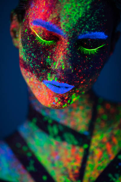 istock One woman painted with fluorescent make up 1138480199