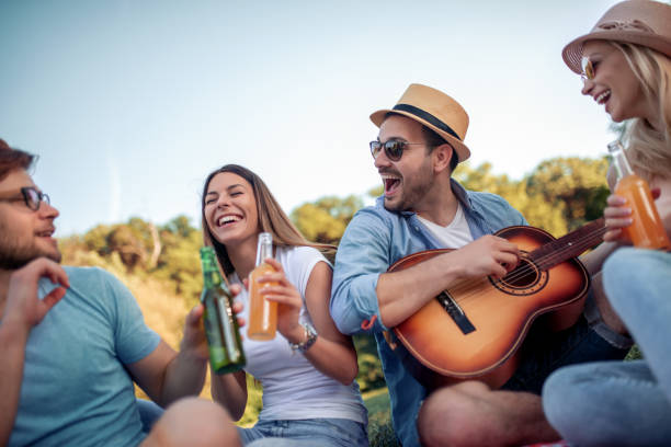 istock Cheerful group of friends having fun in park 1138480731
