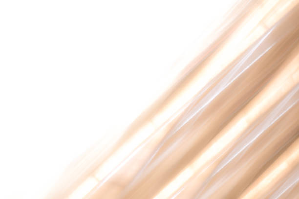 istock Elegant striped orange and gold background pattern fading into white space 1138480894