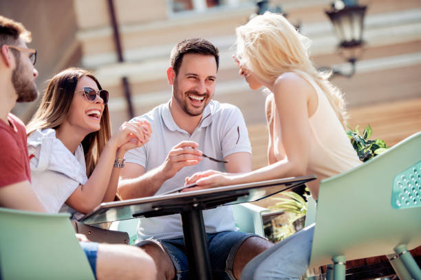 istock Cheerful group of friends having fun in cafe 1138481634