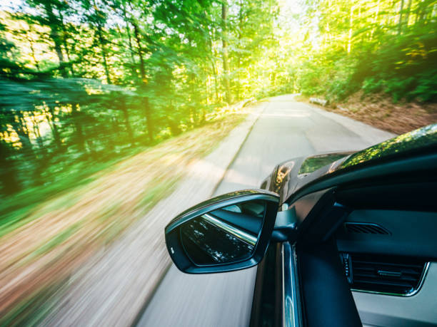 istock Car new modern fat driving in forest toward destination 1138481694