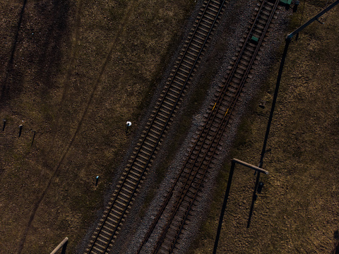 Top aerial view of some railraod tracks -Texture isolated shot of railway - Drone photo