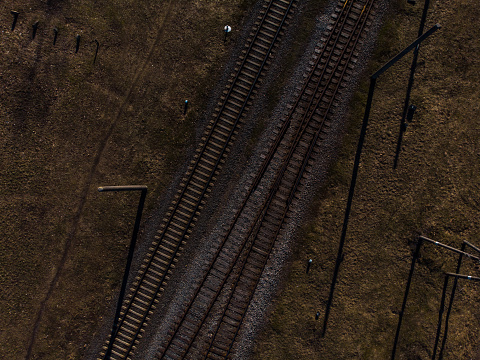 Top aerial view of some railraod tracks -Texture isolated shot of railway - Drone photo