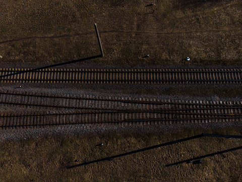 Top aerial view of some railraod tracks -Texture isolated shot of railway - Drone photo