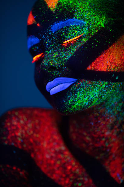 istock One woman painted with fluorescent make up 1138483759