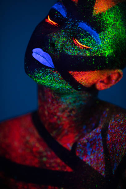 istock One woman painted with fluorescent make up 1138483798