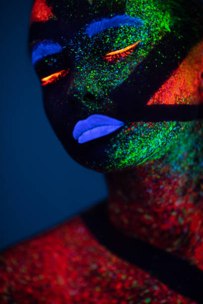 istock One woman painted with fluorescent make up 1138483850
