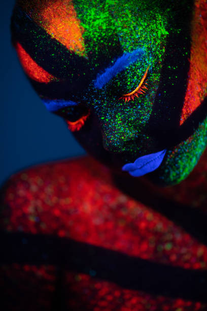 istock One woman painted with fluorescent make up 1138483889