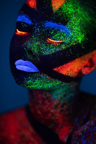 istock One woman painted with fluorescent make up 1138483920