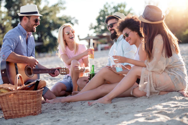 istock Group of friends having fun on the beach 1138483933