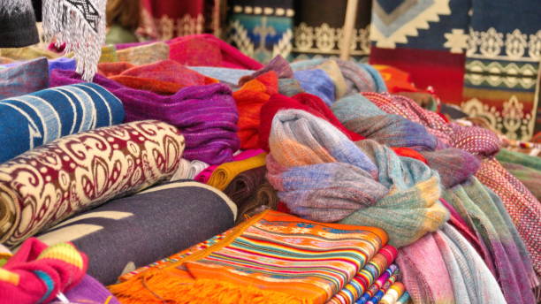 istock Colorful blankets and scarves on a table 1138484102