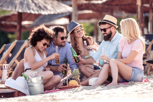 istock Group of friends having fun on the beach 1138484642