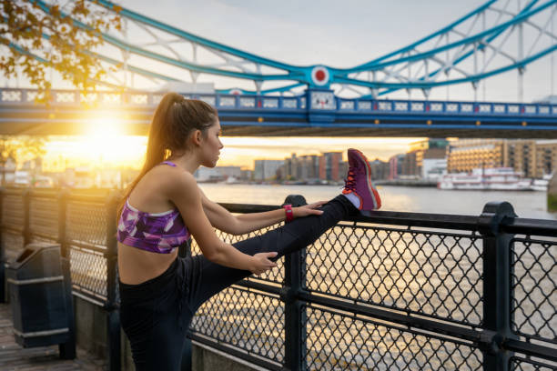 istock Athletic woman does her stretches after an early morning workout 1138486253