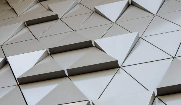 istock Futuristic Wall of relief metallic triangles. 3d geometric background. low angle view 1138489308