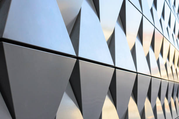 istock Futuristic Wall of relief metallic triangles. 3d geometric background. 1138489310