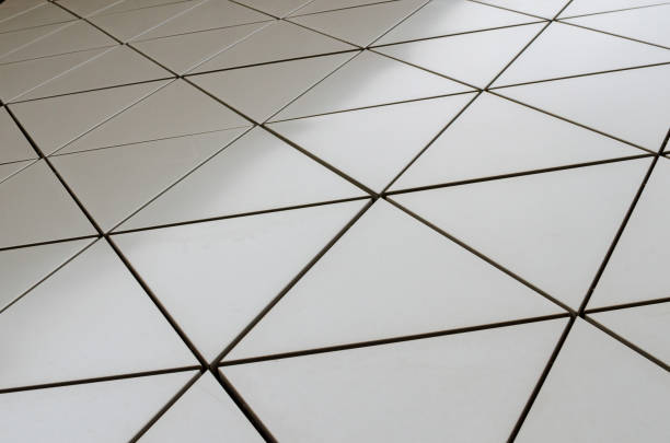 istock Futuristic Wall of metallic triangles with black borders. smooth geometric background. low angle view 1138489356