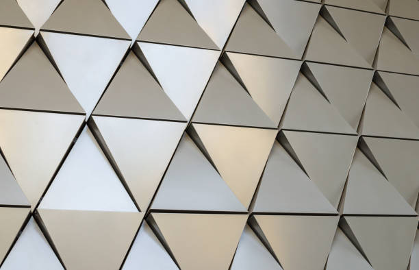 istock Futuristic Wall of relief metallic triangles. 3d geometric background. 1138489397