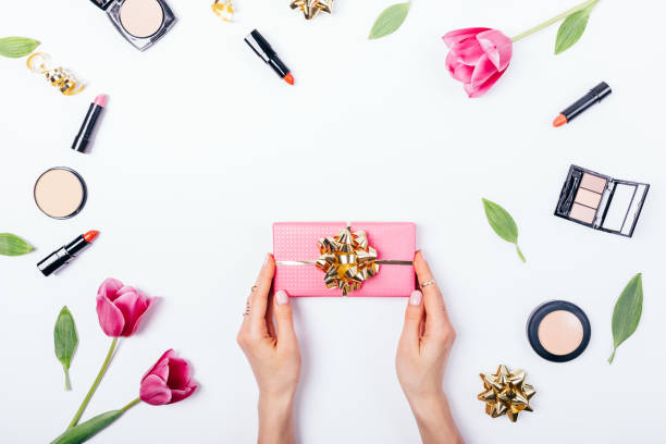 istock Woman's hands holding pink gift box 1138490124