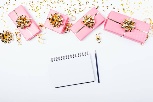 istock Blank notepad and pencil near festive bright pink gift 1138490236
