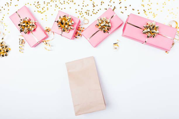 istock Plain brown paper bag next to festive pink 1138490239