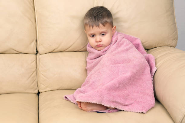 istock small child wrapped in a towel after bathing 1138494310