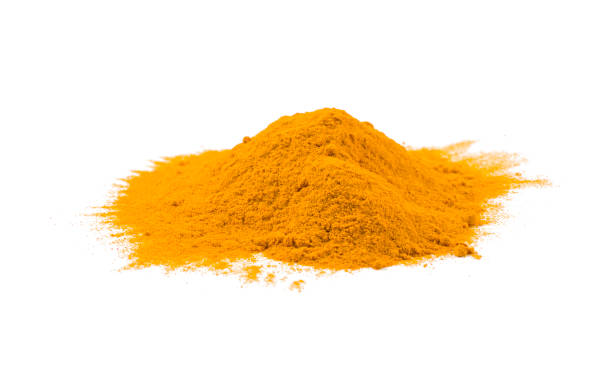 istock turmeric heap isolated on white background. front view. 1138502070