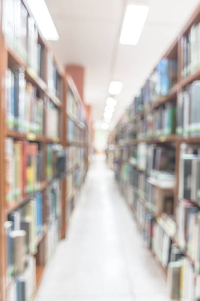 istock Blur school library or study room with book shelves for education background 1138504128