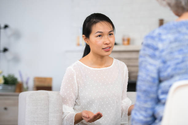 istock Woman speaking to therapist 1138504813