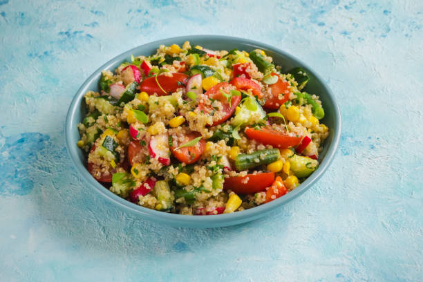 istock Quinoa salad with green leaves and vegetables. 1138506250