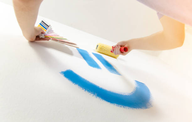 istock Worm eye view man painting indoors 1138513938