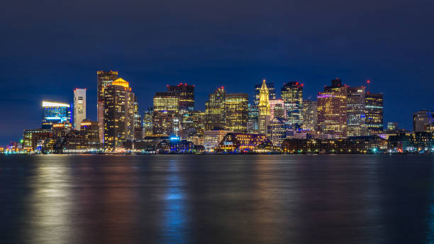 boston skyline at night boston skyline at night boston skyline night skyscraper stock pictures, royalty-free photos & images