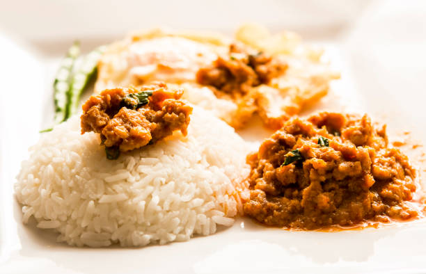 Panaeng  curry  with egg and rice in plate
