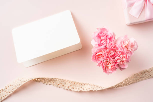 istock top view of carnation with card on pink background 1138519707