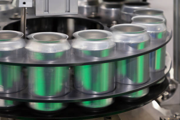 istock empty new aluminum cans for drink process are moving in factory line on conveyor belt machine at beverage manufacturing. food and beverage industrial business concept. 1138520726