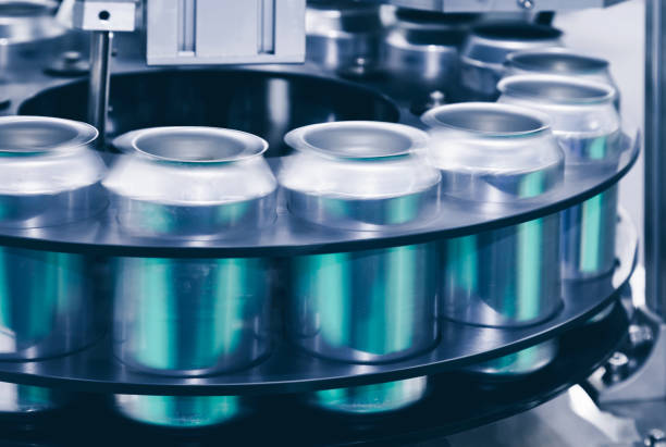 istock empty new aluminum cans for drink process are moving in factory line on conveyor belt machine at beverage manufacturing. food and beverage industrial business concept. vintage cool tone photo style. 1138520736