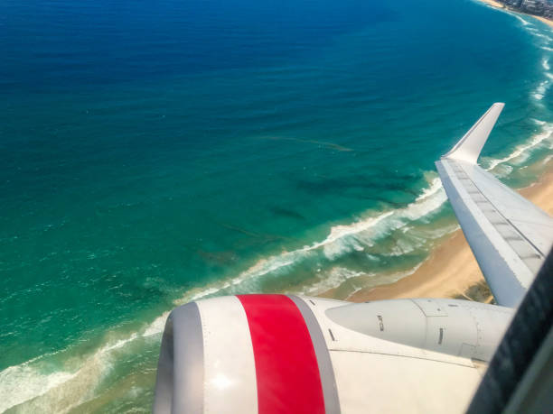 istock Plane Wing Over Gold Coast Beach 1138525915